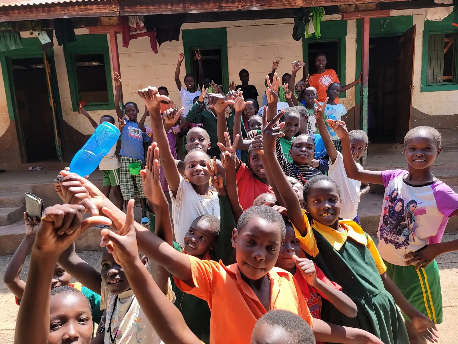 Hands raised together at the end of a gathering