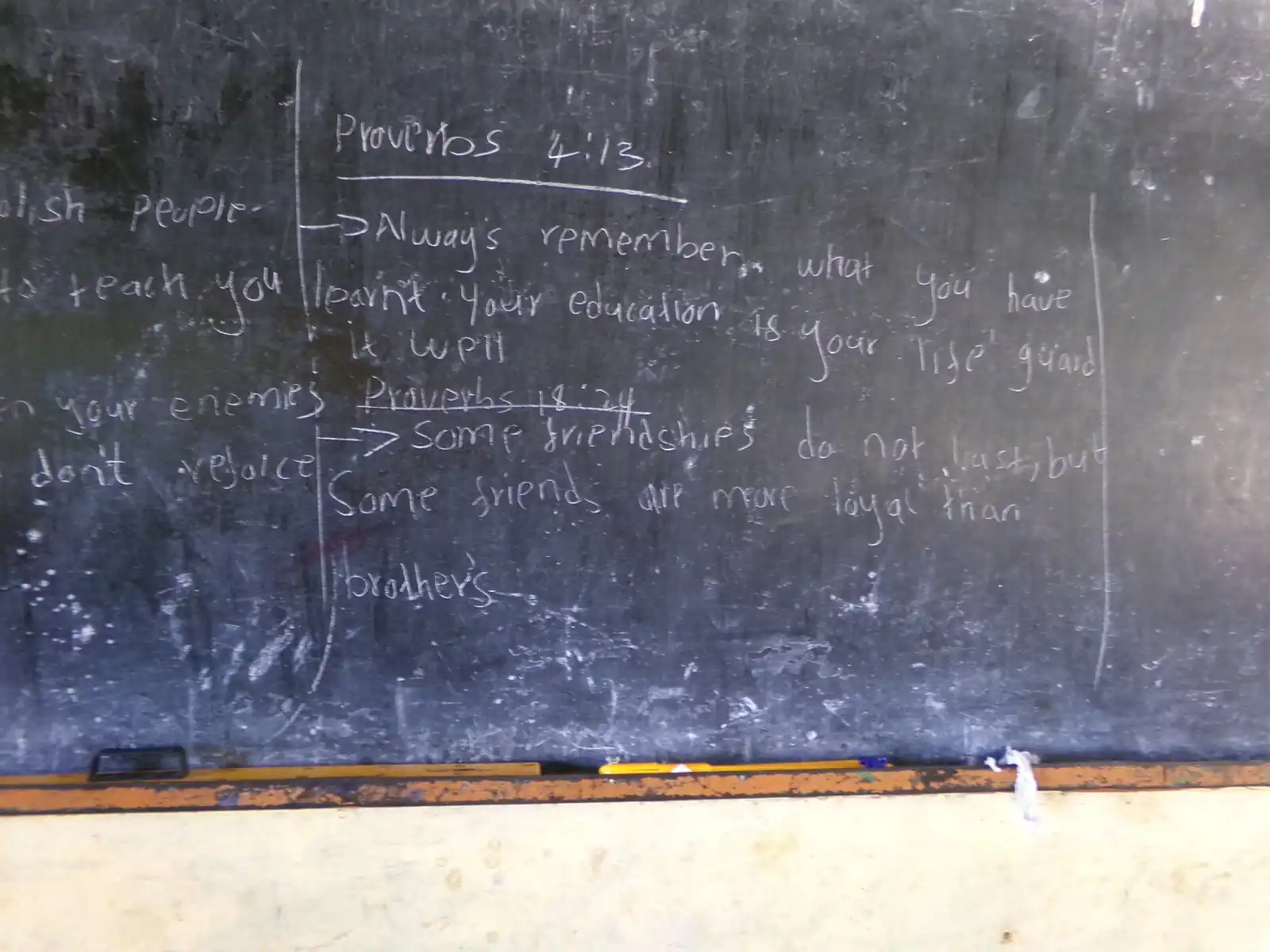 A classroom blackboard: "Always remember, after you leave, your education is your life goal"