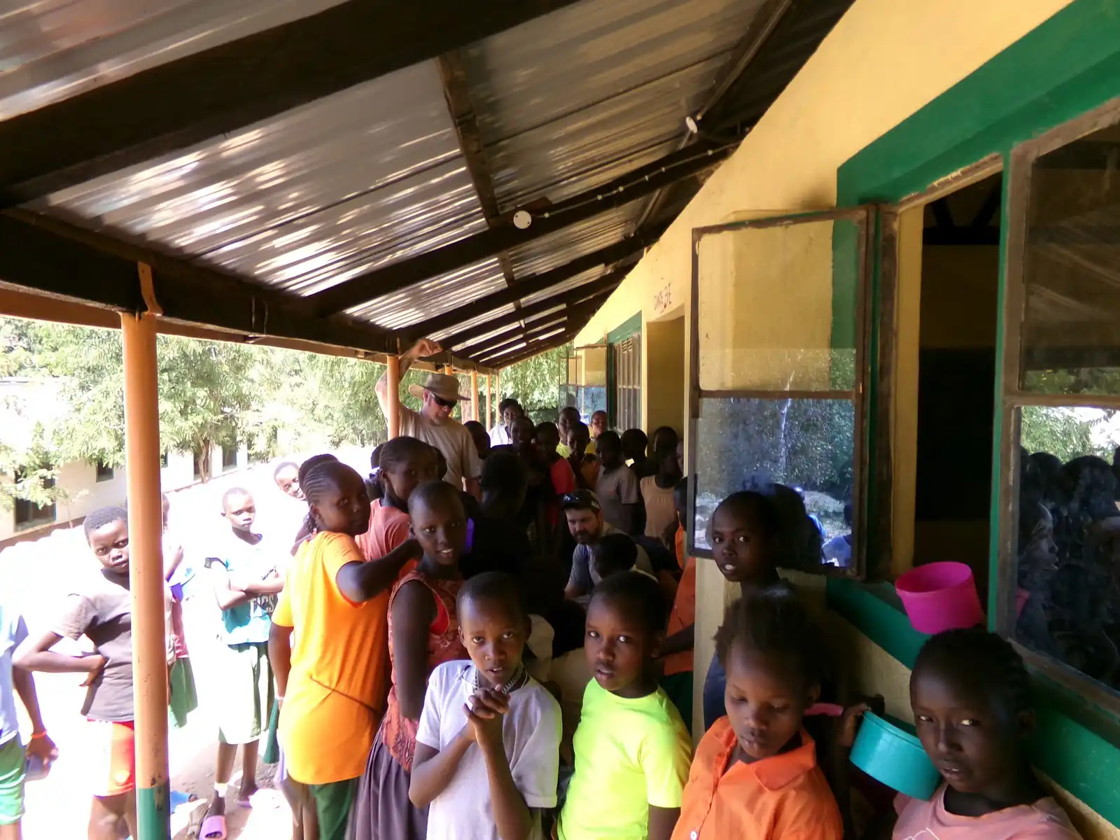 A crowd of pupils under the covered walkway