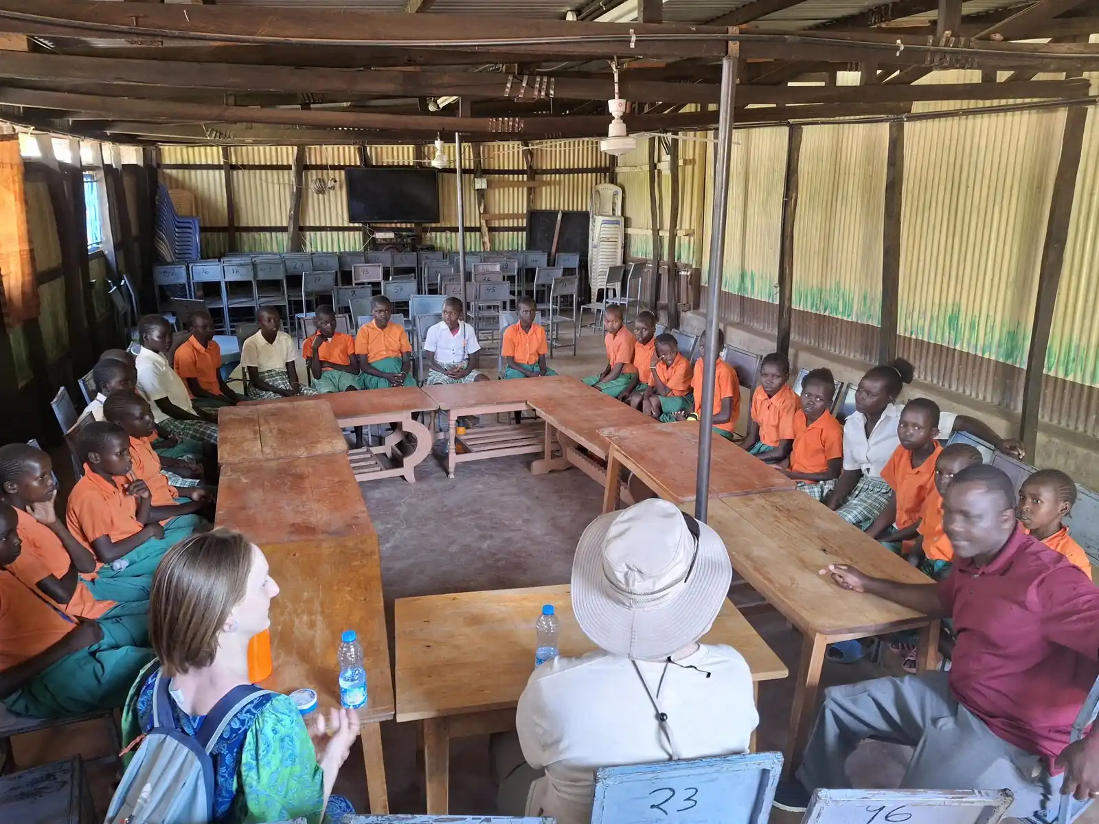 Pupils seated at the long tables in the hall
